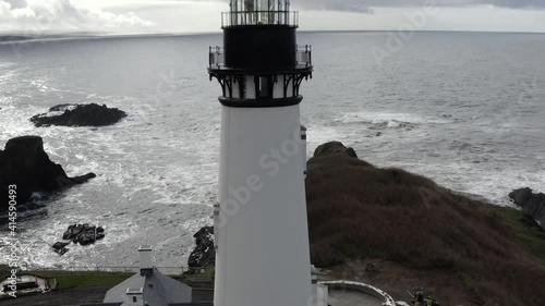 Yaquina Head Lighthouse and Oregon coast. Aerial pedestal up photo