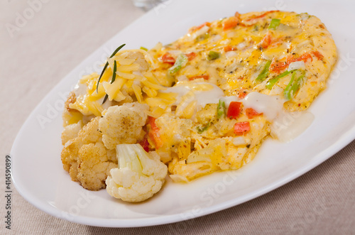 Baked omelet with cauliflower on a plate. High quality photo
