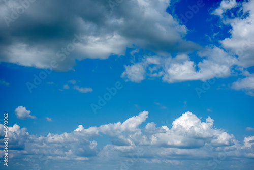 Blue sky fluffy white clouds on summer season bright clear skyline with beautiful cloudscape. Panorama blue sky clouds pattern on daylight with copy space. Cumulus cloudscape air climate sunny day