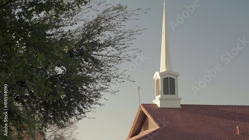 LDS Church Building Roof White Spire during Sunrise Zooming Out 4K