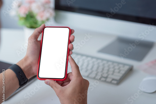 Close up hand businessman holding phone blank screen. Mockup.