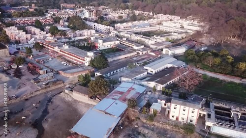 Ancient Buildings And Structure In The City Of Garhwal Mandal Vikas Nigam In Rishikesh, Uttarakhand India. - Aerial Wide Shot photo