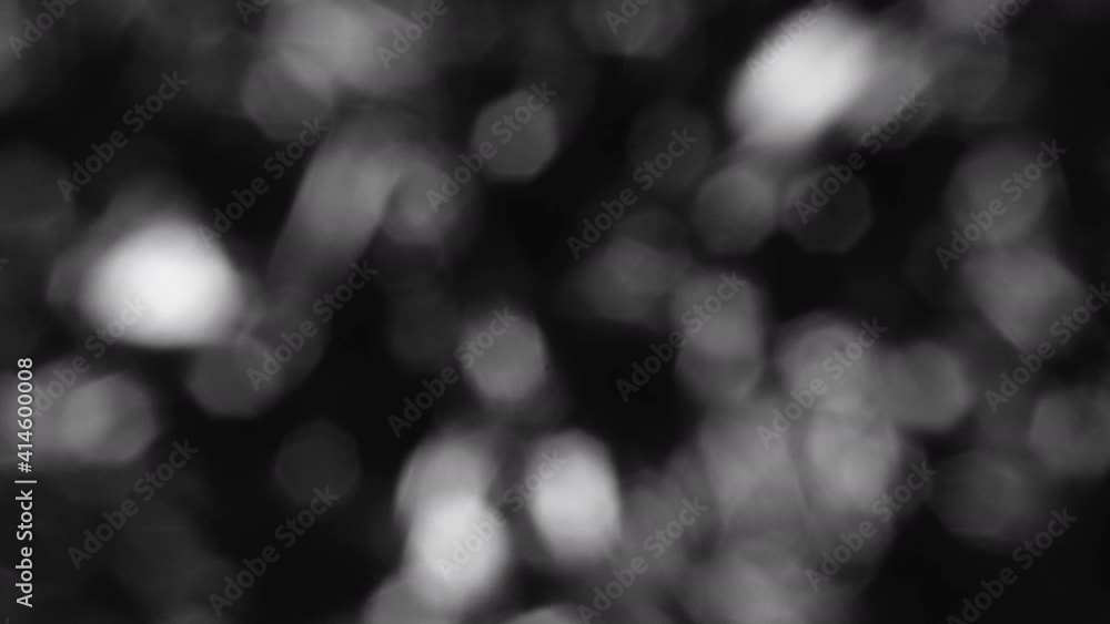 White And Silver Bokeh Light Effect From Tinfoil At Night. - close up White And Silver Bokeh Light Effect From Tinfoil At Night. - close up