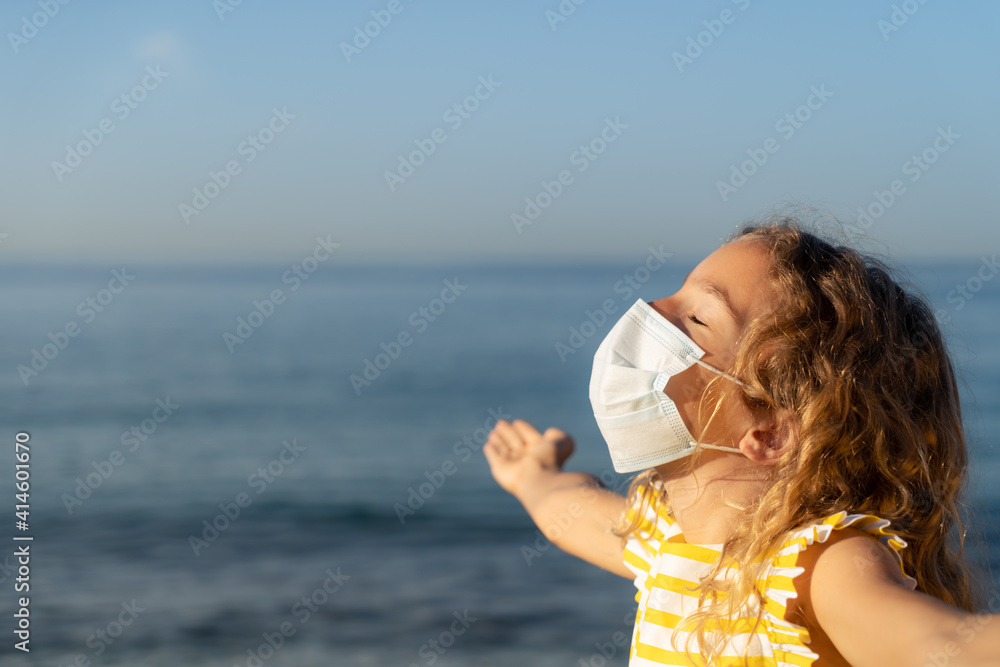 Happy child wearing medical mask outdoor Happy child wearing medical mask outdoor