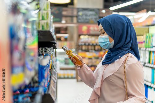 Cute Malay Girl at the mall going shopping wearing face mask