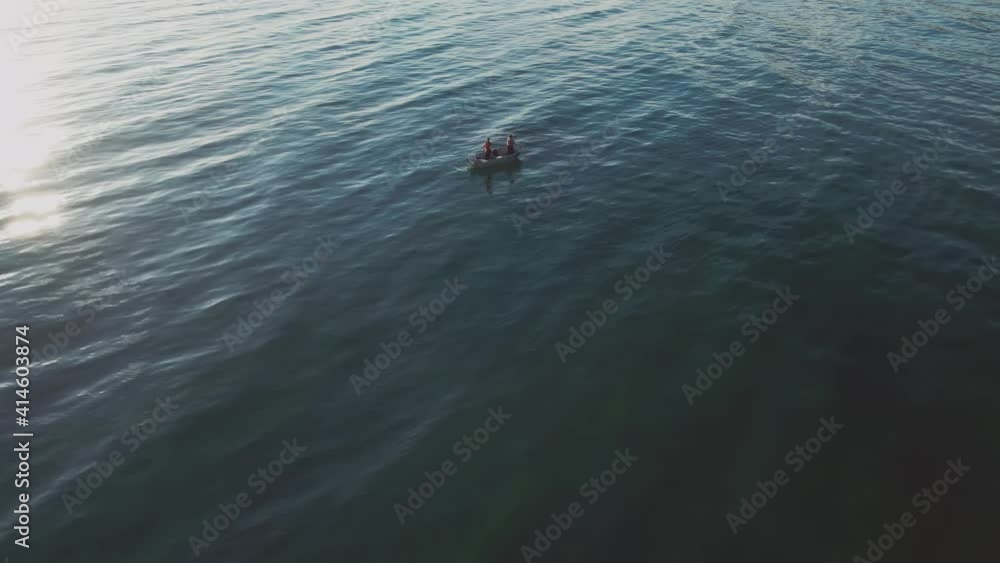 Ocean waves with a small fisherman boat floating Ocean waves with a small fisherman boat floating