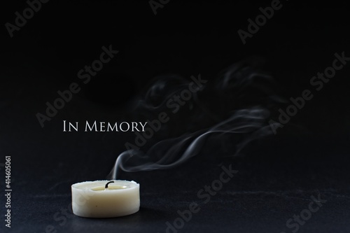 Canvas-taulu In memory of a loved one. Extinguished candle with smoke.