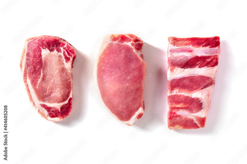Pork meat, various cuts, overhead flat lay shot on a white background Pork meat, various cuts, overhead flat lay shot on a white background
