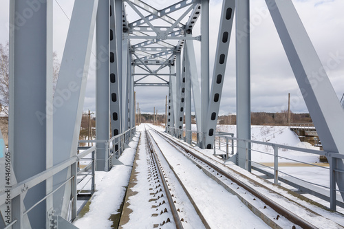 Fototapeta Naklejka Na Ścianę i Meble -  City Riga, Latvia. Old railway bridge and river in winter.Travel photo