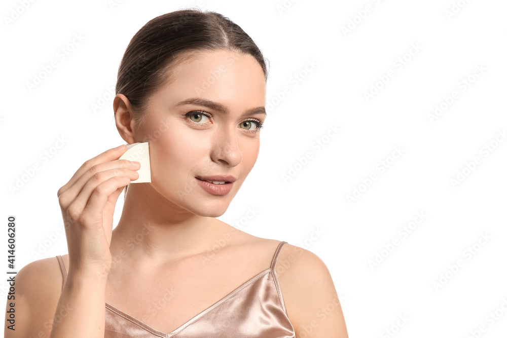 Beautiful young woman with makeup sponge on white background Beautiful young woman with makeup sponge on white background