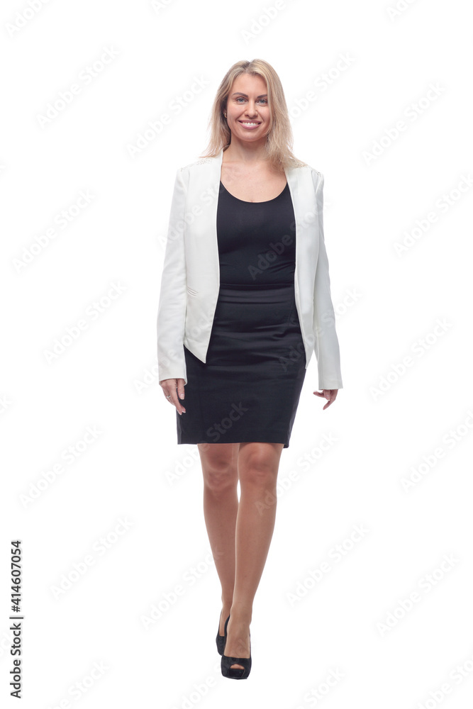 happy young woman in a white jacket striding forward . happy young woman in a white jacket striding forward .