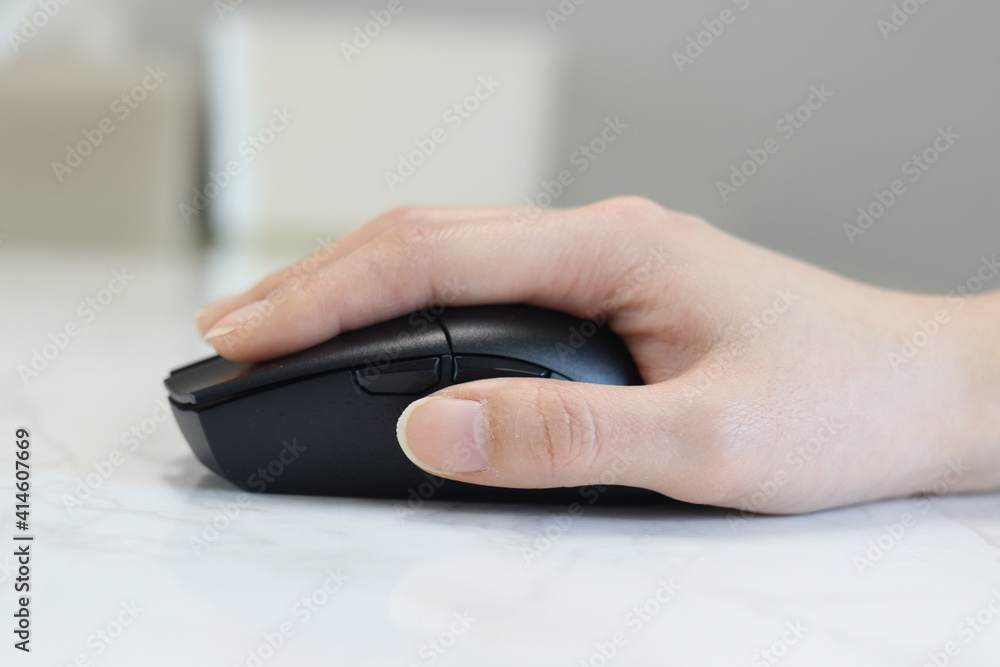 Hands on a computer mouse using close up Hands on a computer mouse using close up
