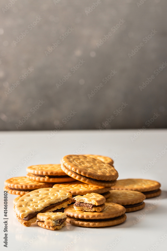 Close up of Sandwich biscuits cookies with chocolate filling on white background Close up of Sandwich biscuits cookies with chocolate filling on white background