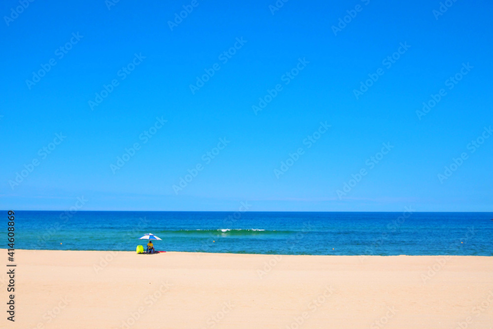 A summer scene where a security guard sits alone looking at the sea. A summer scene where a security guard sits alone looking at the sea.
