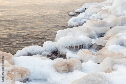 frozen waves water on rocks sunset vibes sea 