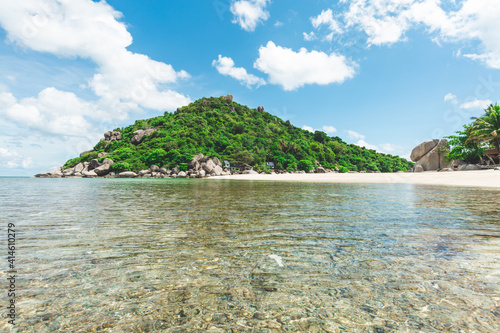 beach with water and an island