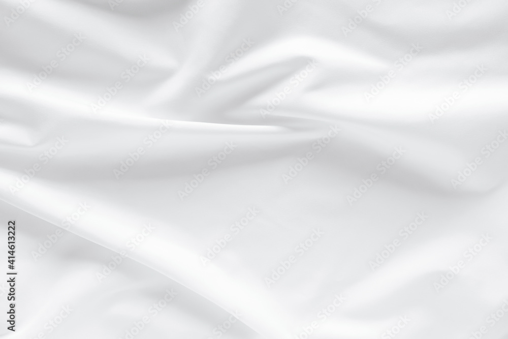 Abstract white fabric texture background. Cloth soft wave. Creases of satin. silk and cotton.