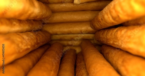 Salty breadsticks arranged in a semicircle. Ready-made baked goods. Close-up. High quality photo.