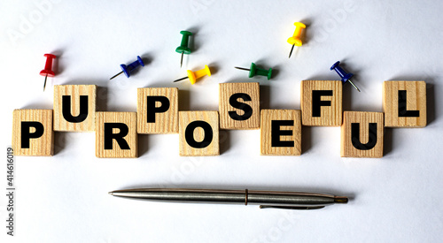Принти на полотні PURPOSEFUL - word on wooden cubes with stationery buttons, pen on white backgrou