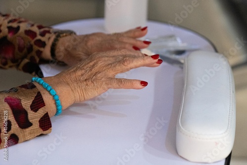 Hands of an older woman getting a manicure