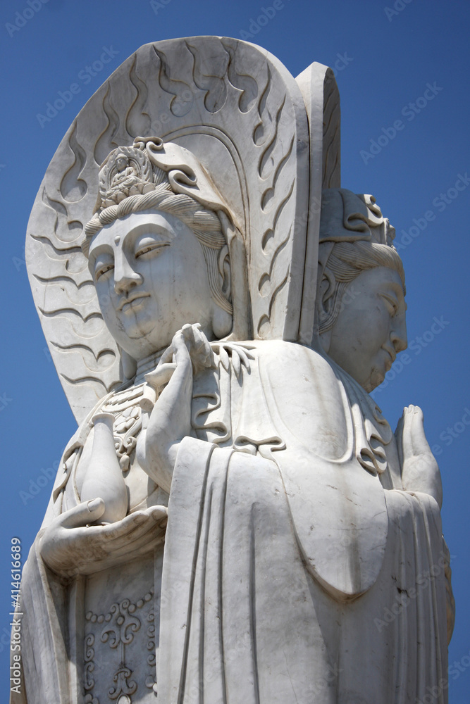 The statue of Guanyin with blue sky