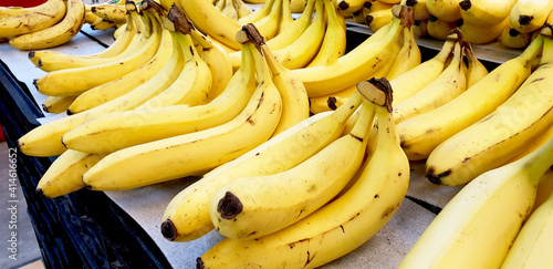 TAKALAR INDONESIA, February 17,2021: a row of ripe fresh bananas on the market photo