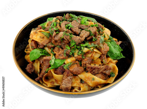 Steak ragu with pappardelle pasta isolated on a white background
