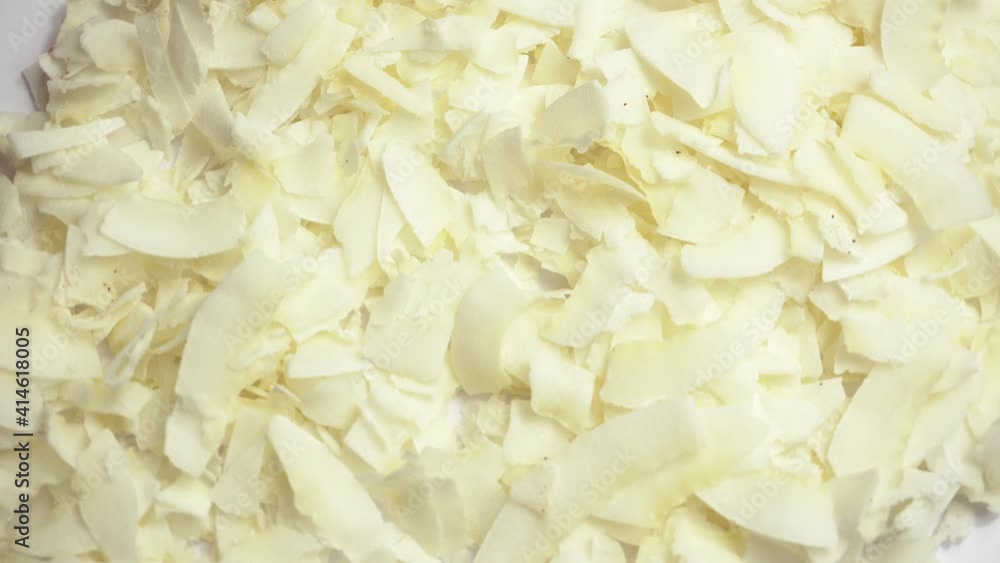 Rotating video of dry flakes cocos over white background. Rotating video of dry flakes cocos over white background.