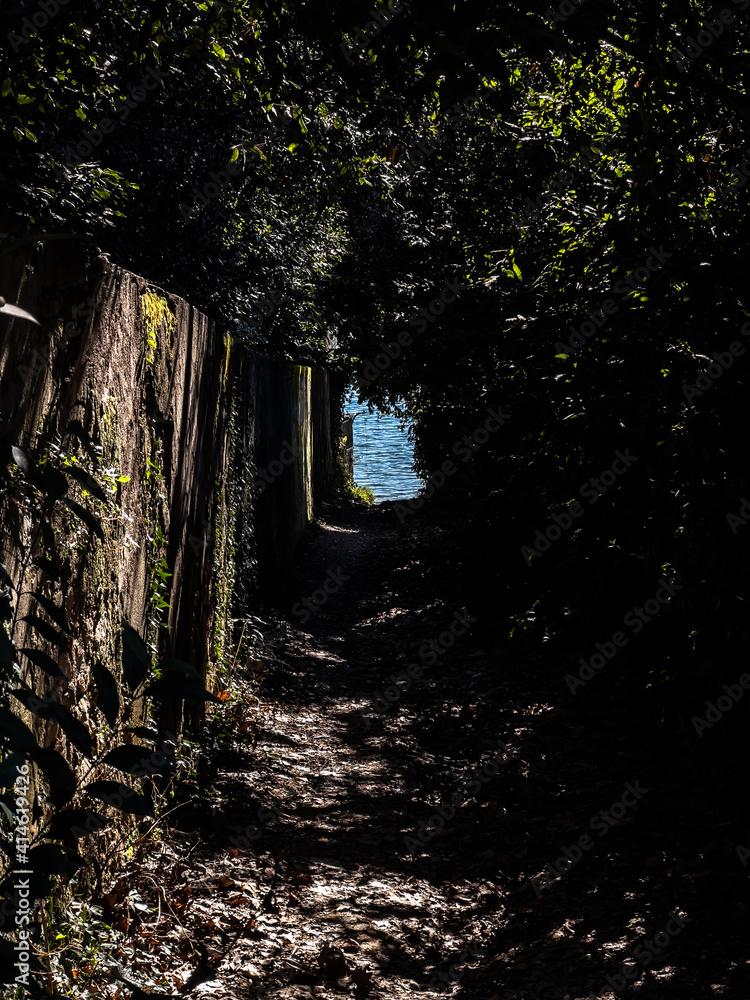 Pleasant view of the coast of Lake Garda. A romantic walk in the town of Garda which gives its name to the lake during a sunny day.