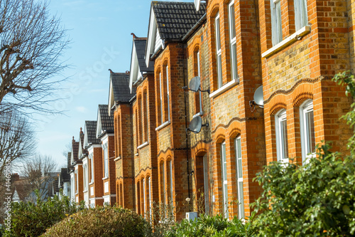 London-  Residential street of terraced houses in Northfields, Ealing West London photo