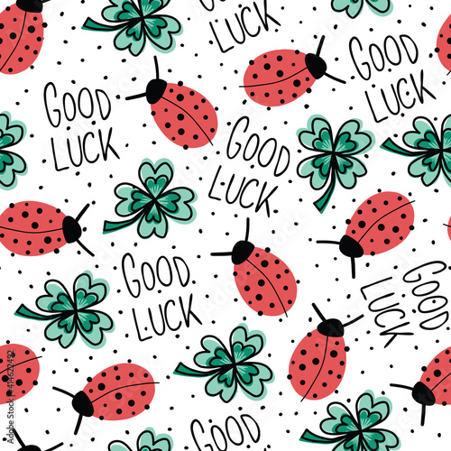 Good luck charms talisman seamless vector pattern. Ladybug, four-leaf clover, Good Luck lettering repeating hand drawn fortune background. Use for New Years, fabric, packaging. Vector illustration.