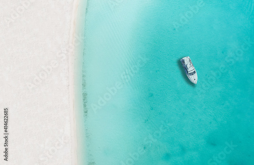Drone photo of beach in Sapodilla Bay, Providenciales, Turks and caicos, boat by itself