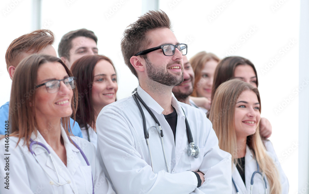 large group of doctors congratulating each other with applause large group of doctors congratulating each other with applause