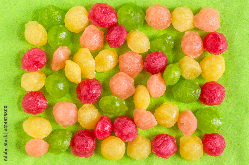 bright spring background - lollipops, the combination of yellow and light green creates an atmosphere of joy, copy space bright spring background - lollipops, the combination of yellow and light green creates an atmosphere of joy, copy space