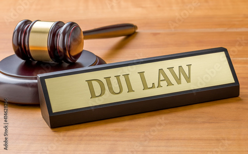 A gavel and a name plate with the engraving DUI Law photo