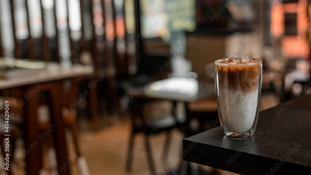 glass of coffee with milk on the table glass of coffee with milk on the table