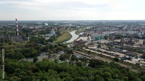 Drone shot of city Poznan, Poland with river Warta in the middle. Poznan Garbary district. Beautiful Poznan from a drone. Different kind of buildings in the urban city. photo