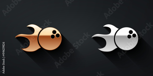 Gold and silver Bowling ball icon isolated on black background. Sport equipment. Long shadow style. Vector.