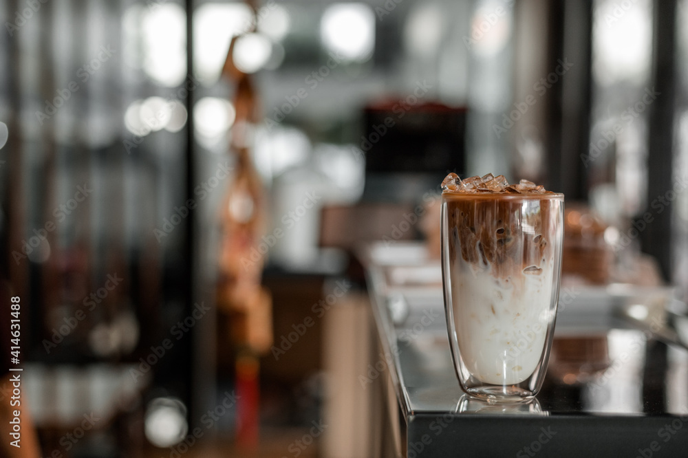 glass of coffee with milk on the table glass of coffee with milk on the table