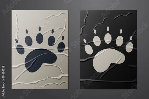 White Bear paw footprint icon isolated on crumpled paper background. Paper art style. Vector.