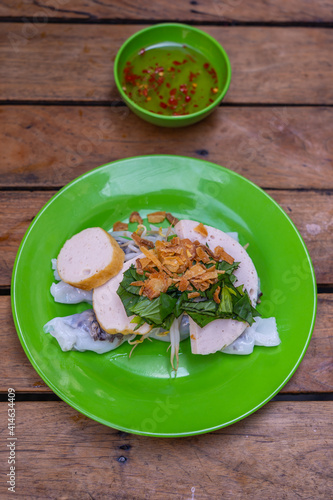 Vertical top view photo of Vietnamese steamed rice noodle rolls - Banh Cuon photo