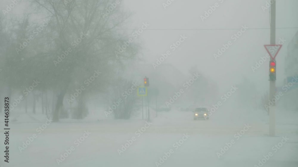 Blizzard on the road and bad visibility. Frosty and snow season winter on the road in the country. Blizzard on the road and bad visibility. Frosty and snow season winter on the road in the country.