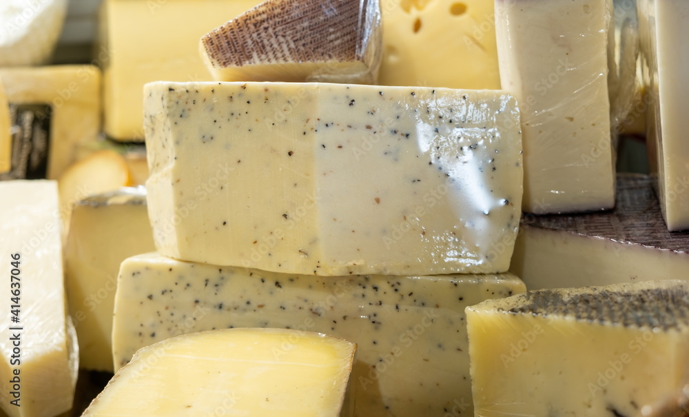 Fototapeta premium cheese with truffle pieces for sale at a local market