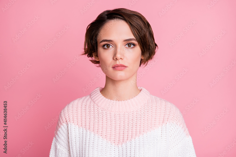 Fototapeta premium Photo portrait of serious woman isolated on pastel pink colored background