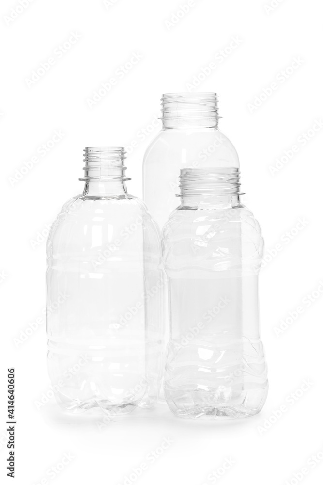 three different empty plastic bottles isolated on white background. production of new containers