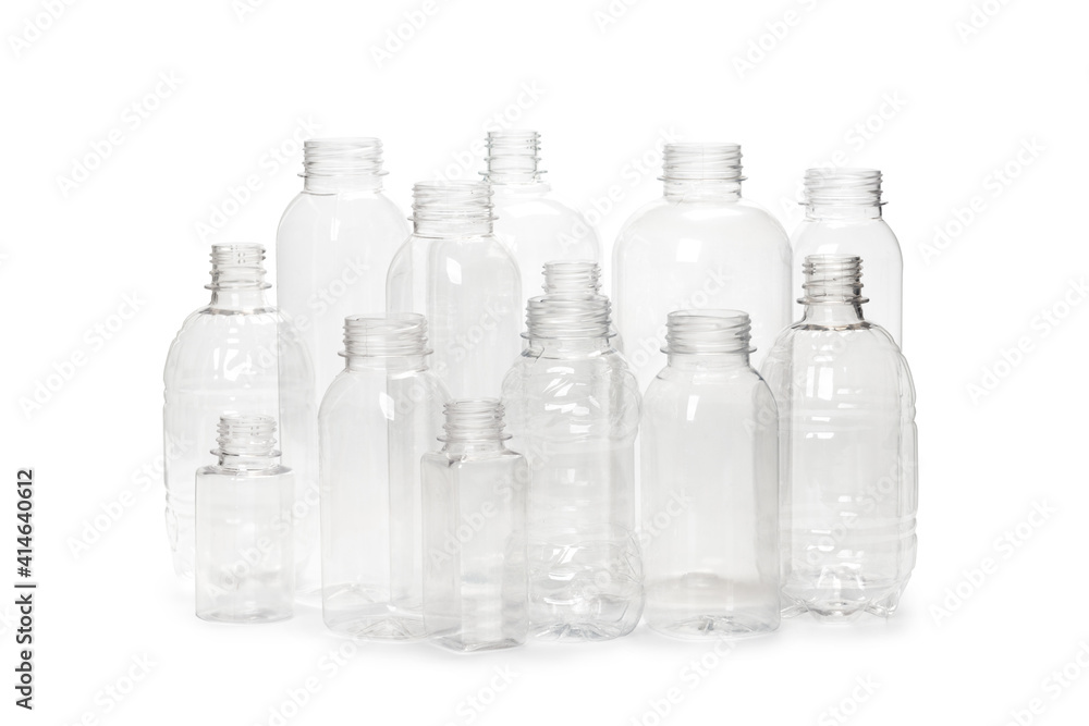 many different empty plastic bottles isolated on white background.