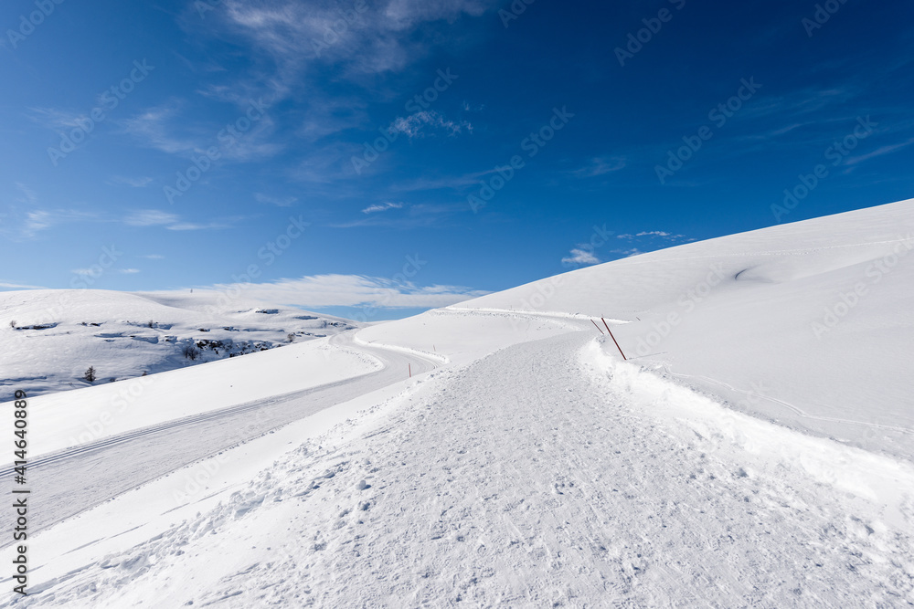 Cross-Country Skiing Tracks and footpath with snow in winter. Altopiano della Lessinia (Lessinia Plateau), Regional Natural Park, near Malga San Giorgio, ski resort in Verona province, Veneto, Italy.