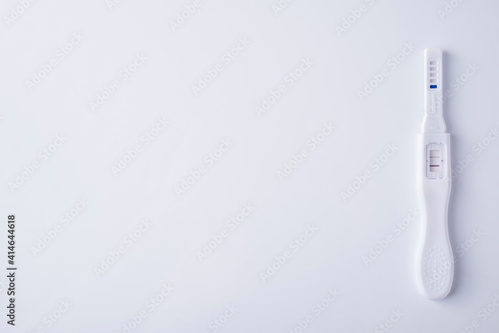 positive pregnancy test on white background. Top view, text space positive pregnancy test on white background. Top view, text space