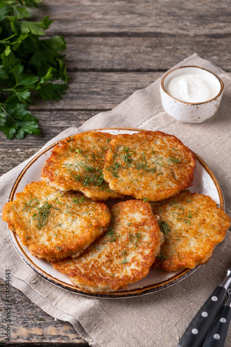 Potato pancakes on a plate in rustic style. Text space