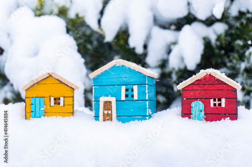 real estate concept colorful model houses in snow